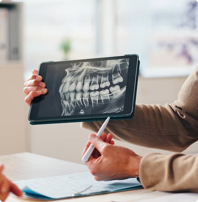 dentist reviewing patient's xray on ipad
