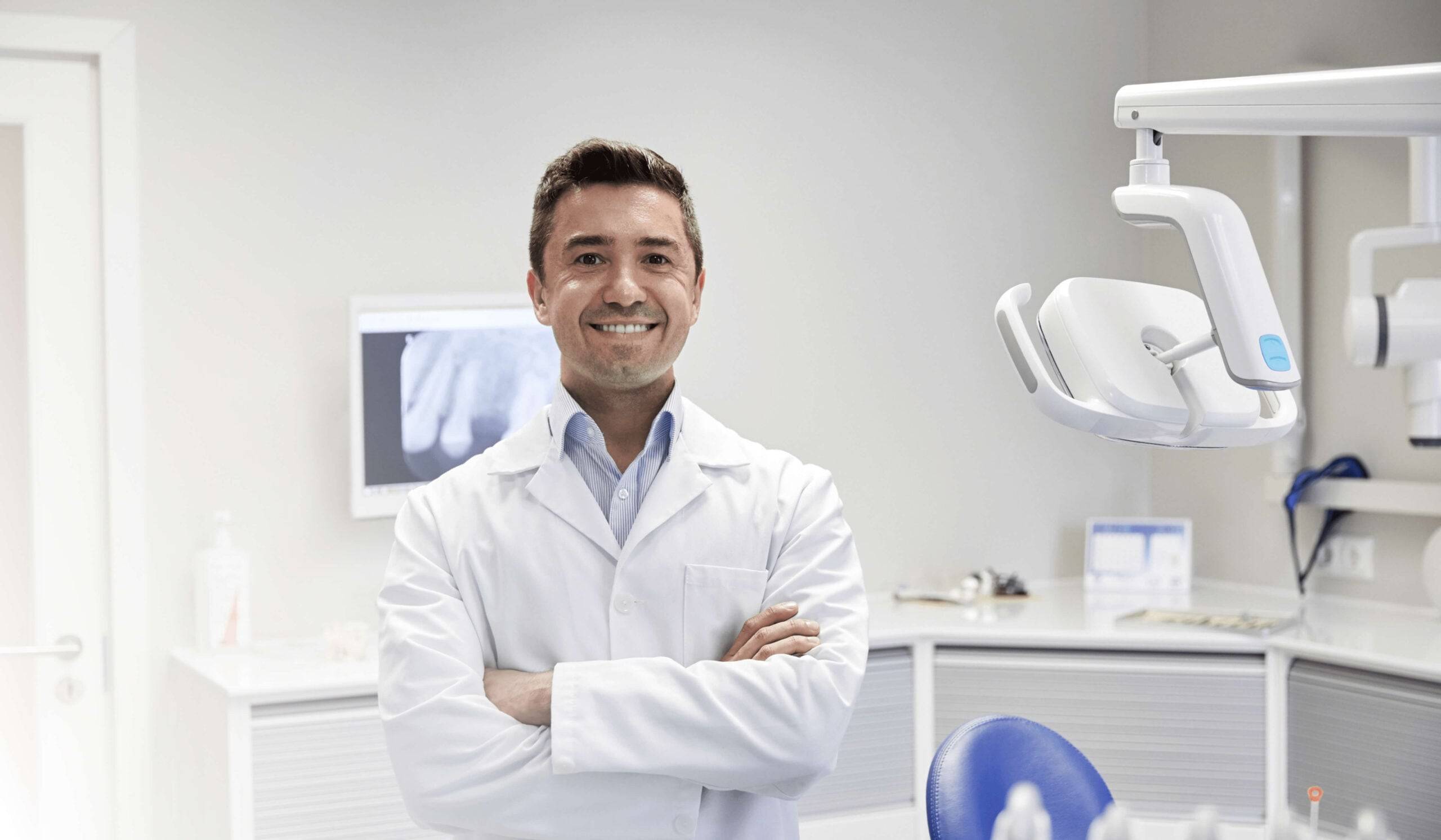 dentist smiling inside office