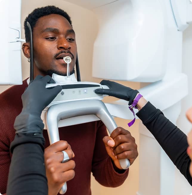 man in endodontics office receiving oral exam