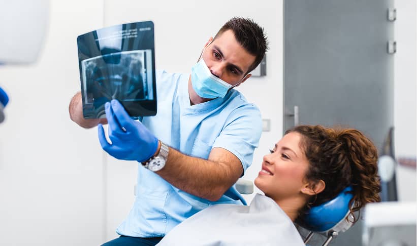dentist showing patient an oral xray