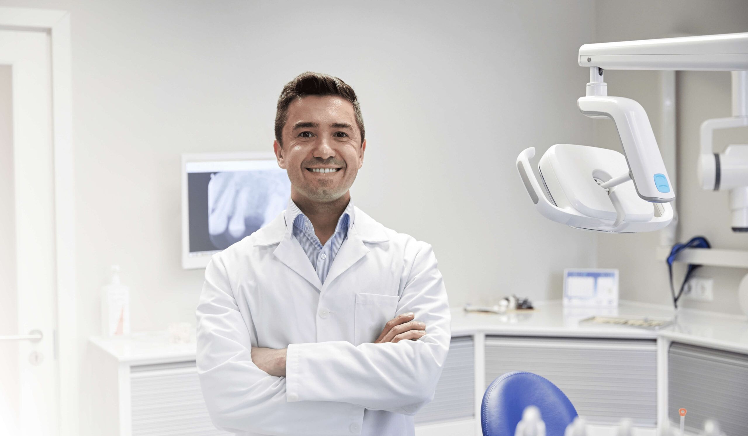 dentist smiling inside office
