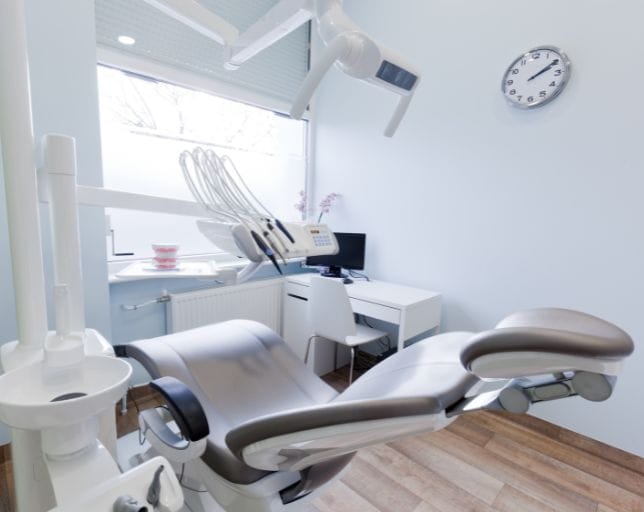 open patient chair inside dental room