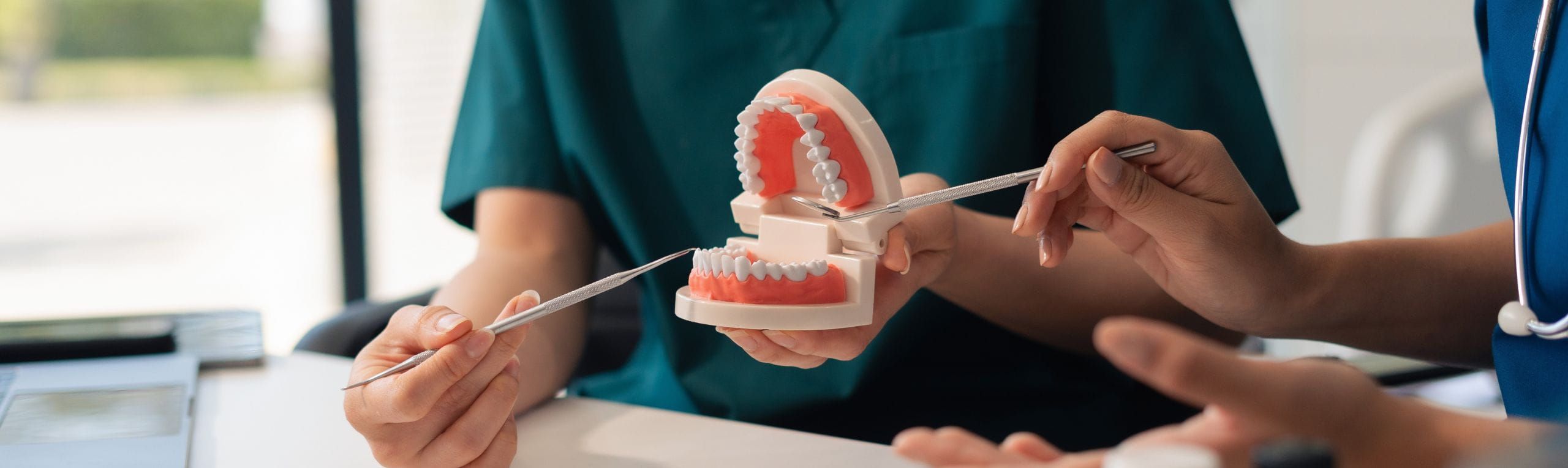 dentist reviewing teeth