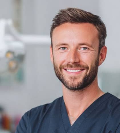 dentist smiling inside office